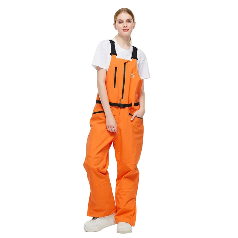 Person wearing orange snow pants with a white background