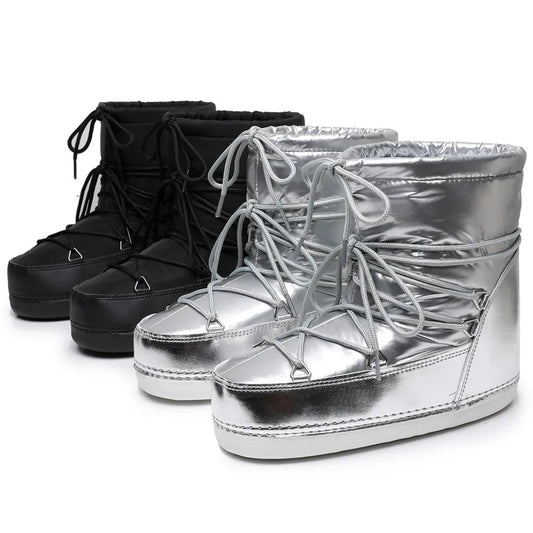 Black and silver platform wedge boots on a white background