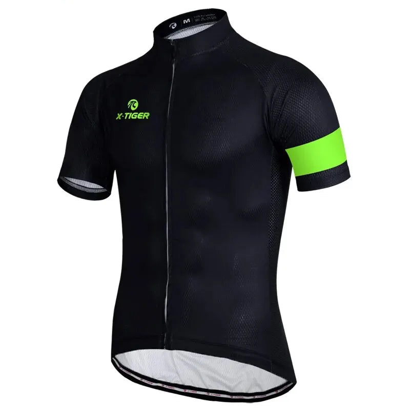 Black cycling jersey with green accents on a white background