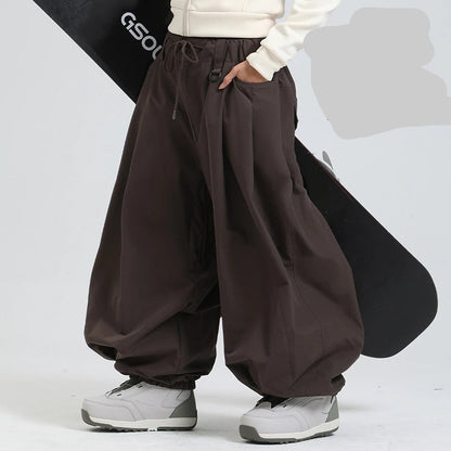 Brown wide-leg pants worn by a person on a white background