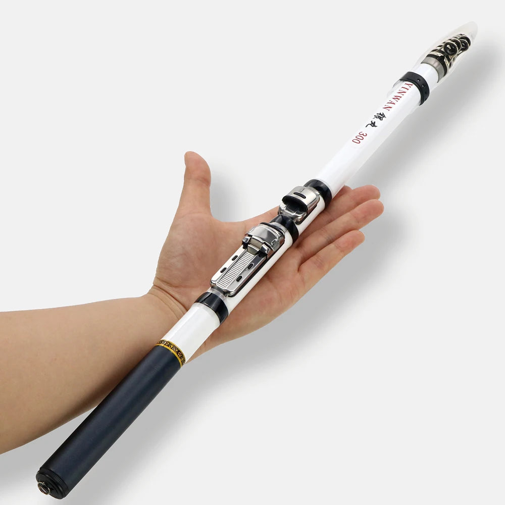 Hand holding a white and black fishing rod  on a light gray background
