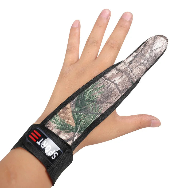 Hand wearing a camouflage finger cot on a white background