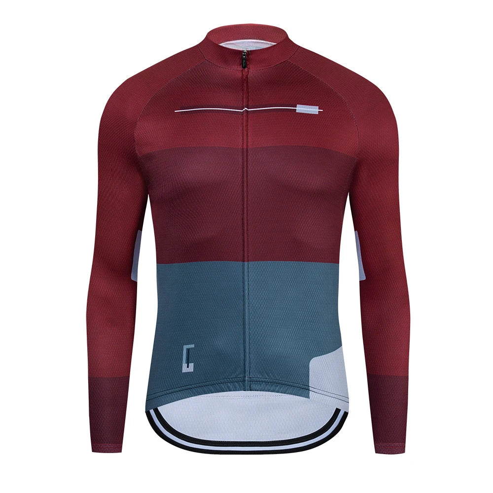 Maroon and teal cycling jersey on a white background