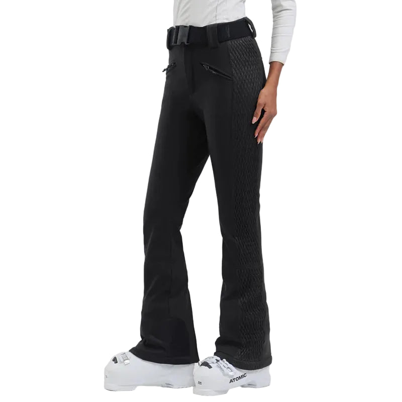 Person wearing black textured pants with a white background