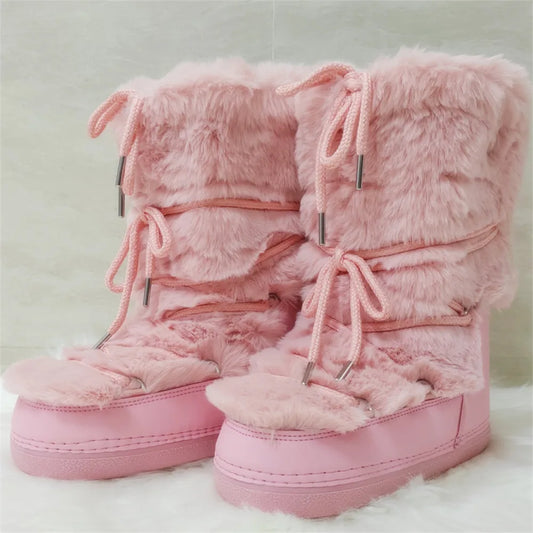 Pink fuzzy boots on a light background