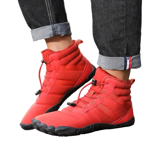 Red high-top sneakers worn on a white background with rolled-up jeans.