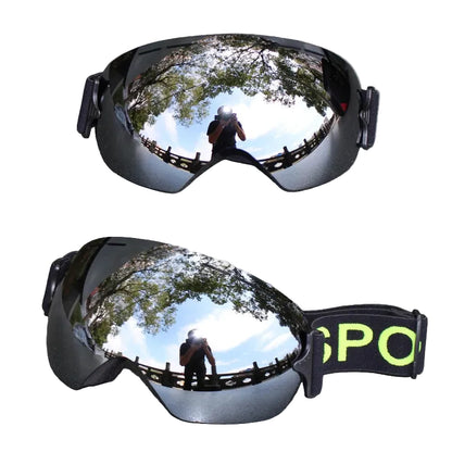 Reflective goggles on a white surface.