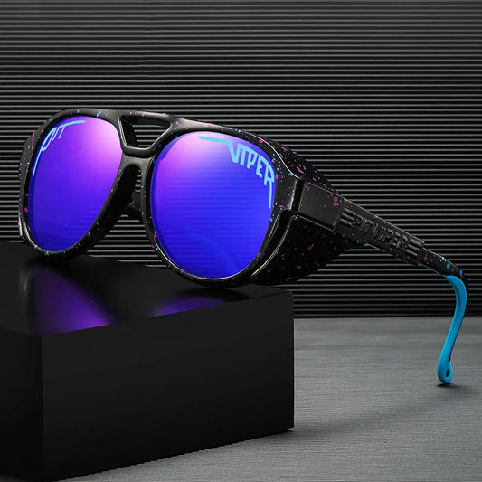 Sunglasses with blue lenses and black frame on a black box against a dark background