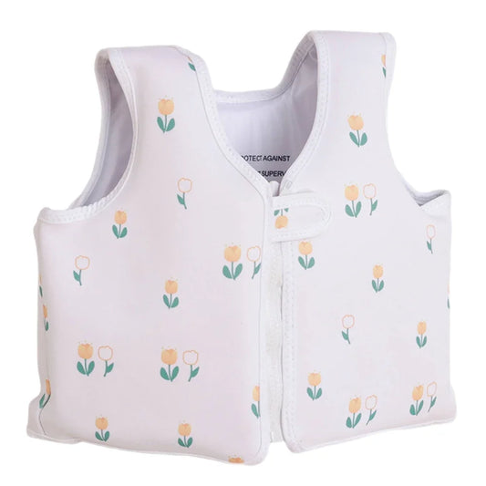 White children's vest with floral pattern on a white background