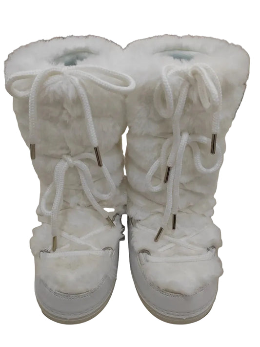 White fluffy boots on a light-colored floor