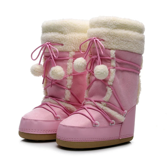 Pink children's boots with white fur lining and pom-poms on a white background