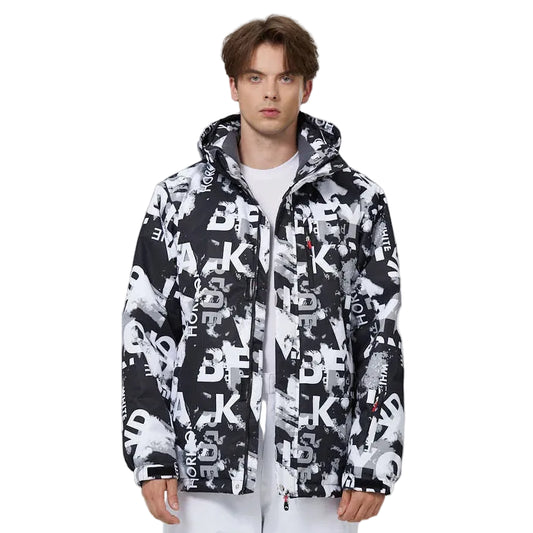 Person wearing a black and white patterned jacket on a gray background