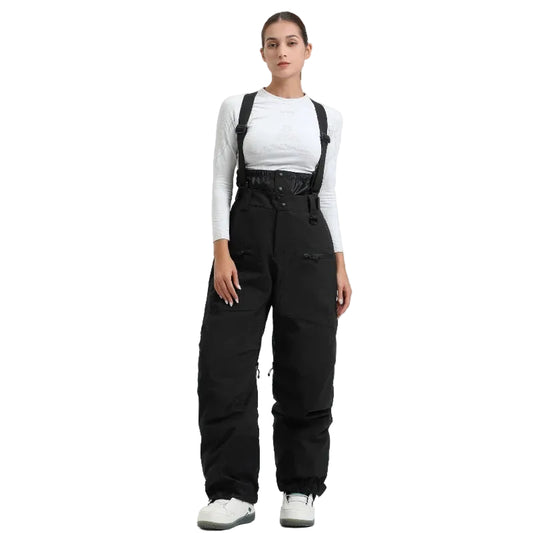 Person wearing black bib overalls on a white background