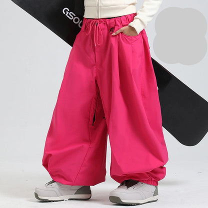 Person wearing bright pink pants with a white background