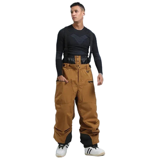 Person wearing brown snow pants and a black top with white background