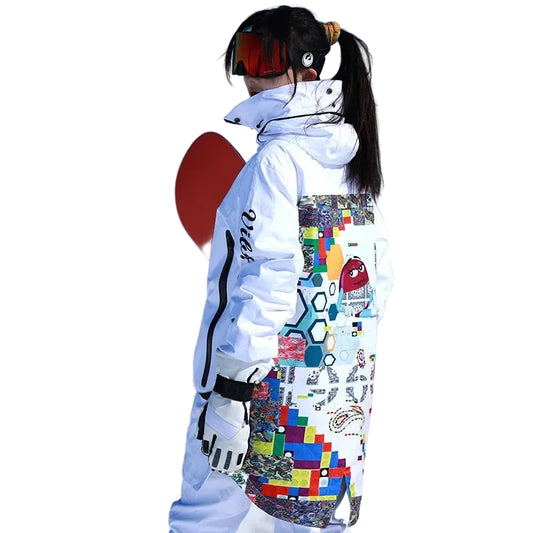 Person wearing a colorful snowboard outfit with a patterned jacket and pants, holding a red snowboard on a white background.