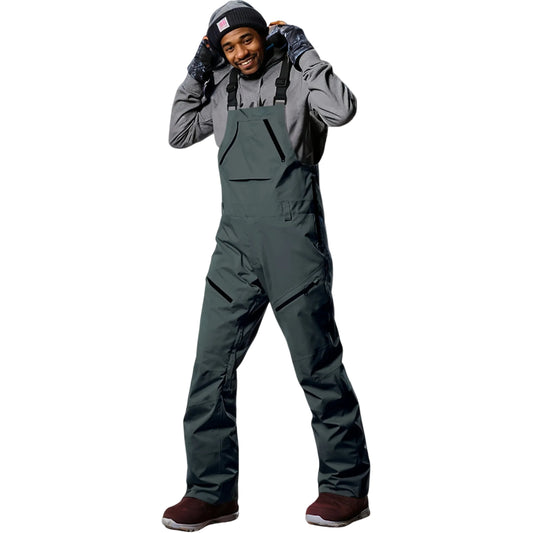 Person wearing a gray snowsuit on a light white background