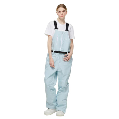 Person wearing light blue overalls and a white shirt on a white background
