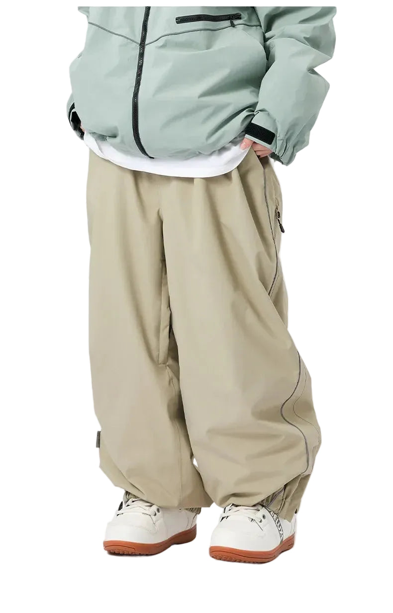 Person wearing a light green jacket, white shirt, beige pants, and white sneakers on a white background