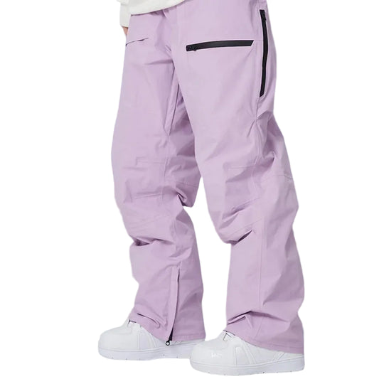 Person wearing light purple snow pants with black zippers on white background