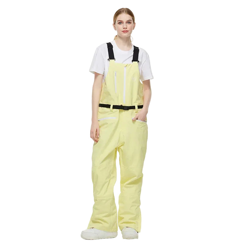 Person wearing a light yellow bib overalls with a white shirt underneath on a white background