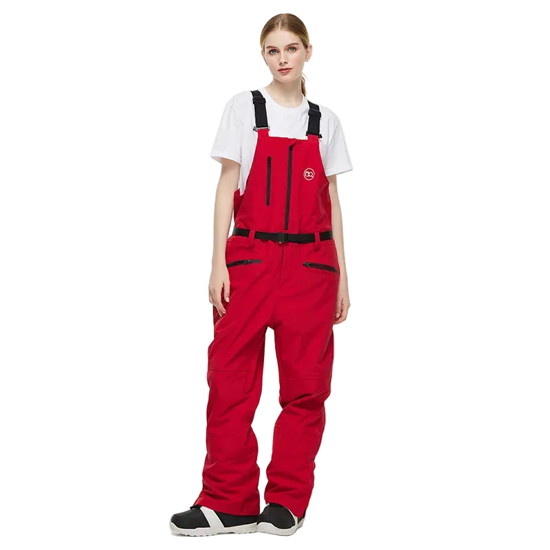 Person wearing a red snowmobile bib overalls on a white background