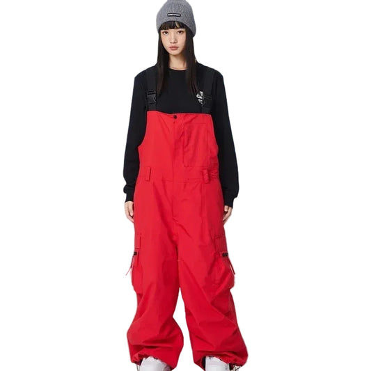 Person wearing a red snowsuit and black top in a snowy landscape